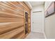 Hallway view of a modern wood sauna with a glass door at 952 Moores Walk Ln, Suwanee, GA 30024