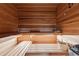 Interior view of a wood sauna with benches and a heater at 952 Moores Walk Ln, Suwanee, GA 30024