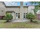 An exterior view of the back of a home with a patio and grassy backyard at 2280 Copper Trail Ln, Buford, GA 30519