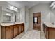 Bathroom featuring double vanity sinks, tile floor and access to the bedroom at 2280 Copper Trail Ln, Buford, GA 30519