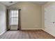 Spacious bedroom featuring neutral walls, carpet, a large window with curtains, and a closet at 2280 Copper Trail Ln, Buford, GA 30519