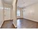 Dining room area with hardwood floors, a chandelier, and a window letting in natural light at 2280 Copper Trail Ln, Buford, GA 30519