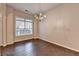 Light-filled dining room with hardwood floors and an elegant chandelier, perfect for entertaining at 2280 Copper Trail Ln, Buford, GA 30519