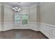 Bright dining room with trim and molding detail, open floor plan at 2280 Copper Trail Ln, Buford, GA 30519