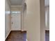 Bright foyer featuring hardwood floors, arched doorways, and a white front door at 2280 Copper Trail Ln, Buford, GA 30519