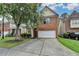 Charming brick-front home with a two-car garage and a well-maintained lawn in a suburban neighborhood at 2280 Copper Trail Ln, Buford, GA 30519