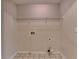 Empty laundry room showing hookups for washing machine and dryer at 2280 Copper Trail Ln, Buford, GA 30519
