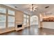 Spacious living room with fireplace and hardwood floors, next to kitchen at 2280 Copper Trail Ln, Buford, GA 30519