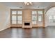 Bright living room features a fireplace, hardwood floors, and large windows at 2280 Copper Trail Ln, Buford, GA 30519