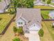 Aerial view of a beautiful home with a well-maintained yard and a neutral-toned roof at 28 Rolling Rock Way, Dallas, GA 30157