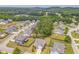 Community aerial view featuring well-maintained homes surrounded by lush trees and serene landscaping at 28 Rolling Rock Way, Dallas, GA 30157