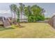 Large, well-maintained backyard featuring a spacious lawn and comfortable lounge chairs, perfect for relaxation at 28 Rolling Rock Way, Dallas, GA 30157