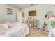 Bright bedroom featuring a TV, desk, large mirror and comfortable bed at 28 Rolling Rock Way, Dallas, GA 30157