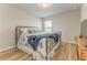 A neatly presented bedroom with wood flooring, a window, and neutral paint at 28 Rolling Rock Way, Dallas, GA 30157