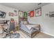 This bedroom is decorated with sports memorabilia, a wood accent wall, and a gaming setup at 28 Rolling Rock Way, Dallas, GA 30157
