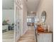 Inviting entryway with wood floors, decorative console table, and view into a bright living area at 28 Rolling Rock Way, Dallas, GA 30157