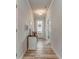 Bright entryway with wood floors, stylish console table, and a view of the front door with wreath at 28 Rolling Rock Way, Dallas, GA 30157