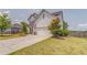 Charming home showcasing a well-kept lawn, mature landscaping, and a clean driveway at 28 Rolling Rock Way, Dallas, GA 30157