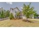 Well-maintained two-story home featuring a lush front lawn and mature trees at 28 Rolling Rock Way, Dallas, GA 30157