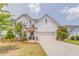 Charming two-story home with white siding, a well-manicured lawn, and a welcoming front entrance at 28 Rolling Rock Way, Dallas, GA 30157