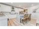 Kitchen island with seating, stainless appliances, and white cabinets at 28 Rolling Rock Way, Dallas, GA 30157