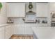 Modern kitchen with white cabinets, subway tile backsplash, and stainless steel appliances at 28 Rolling Rock Way, Dallas, GA 30157