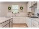 Modern kitchen with white cabinets, subway tile backsplash, and stainless steel appliances at 28 Rolling Rock Way, Dallas, GA 30157