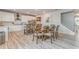 Kitchen and dining area with stainless steel appliances and white cabinets at 28 Rolling Rock Way, Dallas, GA 30157