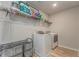Well-organized laundry room with modern washer and dryer and ample storage space at 28 Rolling Rock Way, Dallas, GA 30157