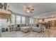 Open-concept living room showcasing a large sectional, dining area, and bright kitchen at 28 Rolling Rock Way, Dallas, GA 30157