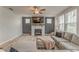 Comfortable living room with fireplace, large sectional sofa, and ample natural light at 28 Rolling Rock Way, Dallas, GA 30157