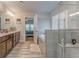 Stunning main bathroom showcasing dual vanities, a soaking tub, and a separate glass shower at 28 Rolling Rock Way, Dallas, GA 30157