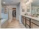 Bright main bathroom with a large vanity, walk-in shower, soaking tub and walk-in closet at 28 Rolling Rock Way, Dallas, GA 30157
