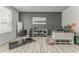 This multi-purpose room features a salon area, modern decor, neutral paint, and wood-look flooring at 28 Rolling Rock Way, Dallas, GA 30157