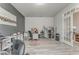 This multi-purpose room features a salon area, modern decor, neutral paint, and wood-look flooring at 28 Rolling Rock Way, Dallas, GA 30157