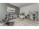 This multi-purpose room features a salon area, modern decor, neutral paint, and wood-look flooring at 28 Rolling Rock Way, Dallas, GA 30157