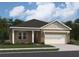 Beautiful brick home featuring an attached garage with pergola and neutral color palette at 329 Torcello Blvd, Mcdonough, GA 30253