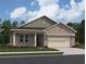 Charming single-story home featuring a brick facade, attached garage, and manicured landscaping at 329 Torcello Blvd, Mcdonough, GA 30253