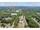 Aerial view of a suburban neighborhood with dense trees, a lake, and the location of the home marked at 3652 Morning Creek Ct, Suwanee, GA 30024