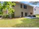 Well-maintained backyard featuring a patio with seating, a lush lawn, and a home's exterior at 3652 Morning Creek Ct, Suwanee, GA 30024