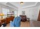Cozy bedroom with hardwood floors, neutral walls, tray ceilings, and bright natural light at 3652 Morning Creek Ct, Suwanee, GA 30024