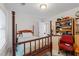 Bright bedroom featuring a four-poster bed, window with blinds, and built-in shelving for ample storage space at 3652 Morning Creek Ct, Suwanee, GA 30024