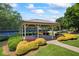 Community gazebo with picnic tables and landscaping, surrounded by lush greenery and a walking path at 3652 Morning Creek Ct, Suwanee, GA 30024