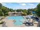Large pool with slides and a community clubhouse with lounge chairs for residents to relax and enjoy at 3652 Morning Creek Ct, Suwanee, GA 30024