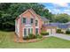 Charming brick home with a well-manicured lawn and a two-car garage at 3652 Morning Creek Ct, Suwanee, GA 30024
