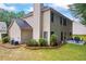 Charming home exterior with neutral siding, a well-manicured lawn, and patio with outdoor seating at 3652 Morning Creek Ct, Suwanee, GA 30024