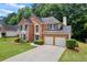 Beautiful two-story brick house with a two-car garage and landscaped yard at 3652 Morning Creek Ct, Suwanee, GA 30024