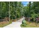 Well-maintained greenway entrance with signage, landscaping, and a smooth paved pathway for outdoor recreation at 3652 Morning Creek Ct, Suwanee, GA 30024