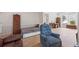 Comfortable living area with a daybed, hardwood floors, a bay window, and unique decorative screens at 3652 Morning Creek Ct, Suwanee, GA 30024