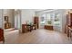 Bright living room featuring a bay window, hardwood floors, and elegant decorative furniture pieces at 3652 Morning Creek Ct, Suwanee, GA 30024
